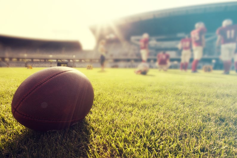 Ball with college football players