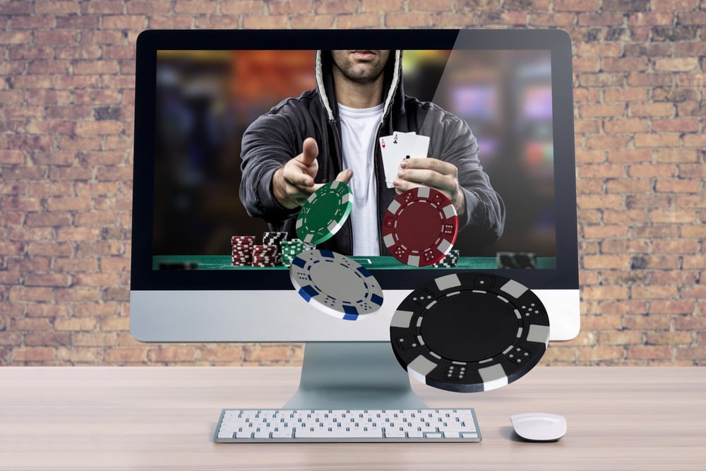 online poker representation shows player on desktop throwing chips through the screen